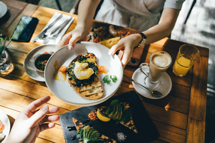 Two people enjoying a fresh, colorful meal together